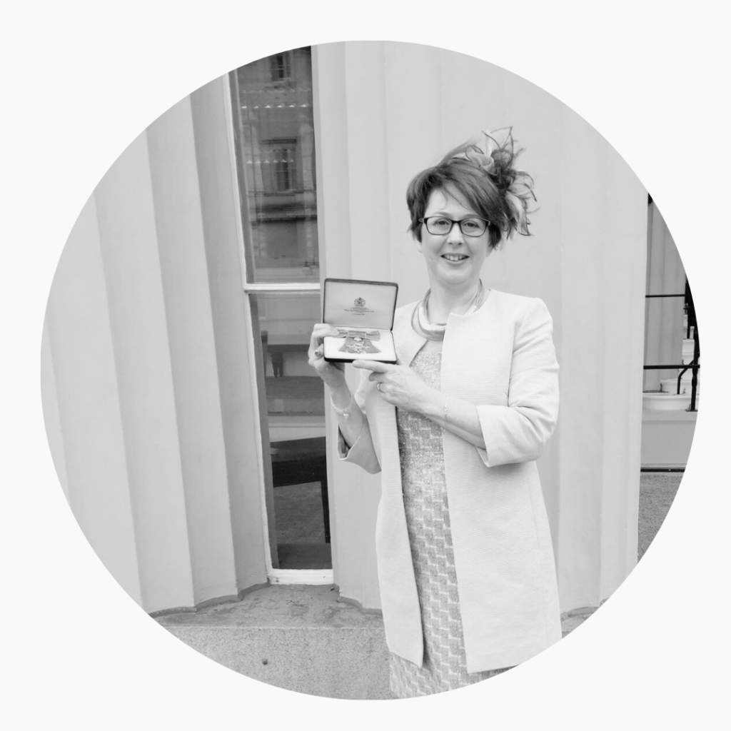 Jan pictured holding her MBE at Buckingham Palace